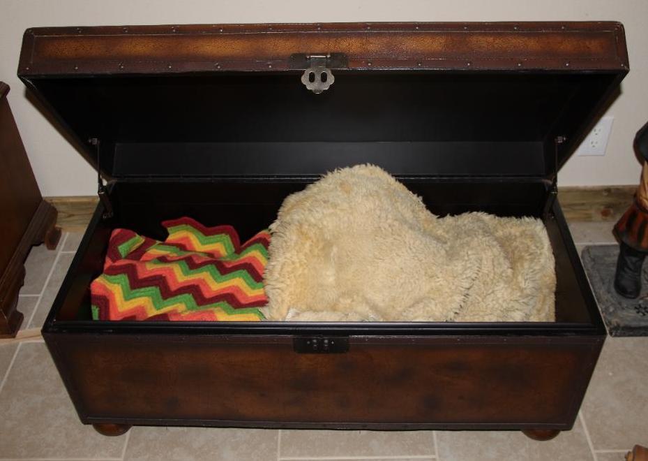 Large Brown Trunk with Blankets and Partial Sheepskin
