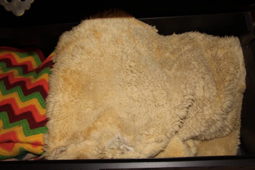 Large Brown Trunk with Blankets and Partial Sheepskin