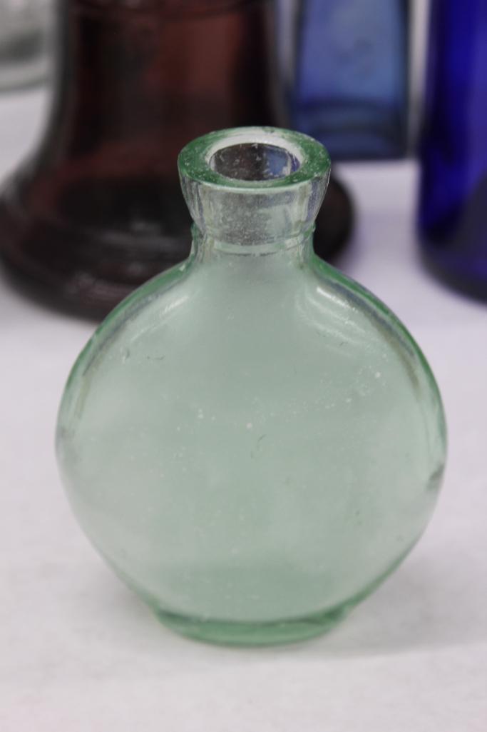 Mixed Clear and Colorful Glass Bottles, Insulators, and More