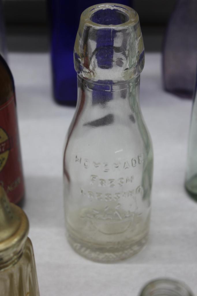 Mixed Clear and Colorful Glass Bottles, Insulators, and More