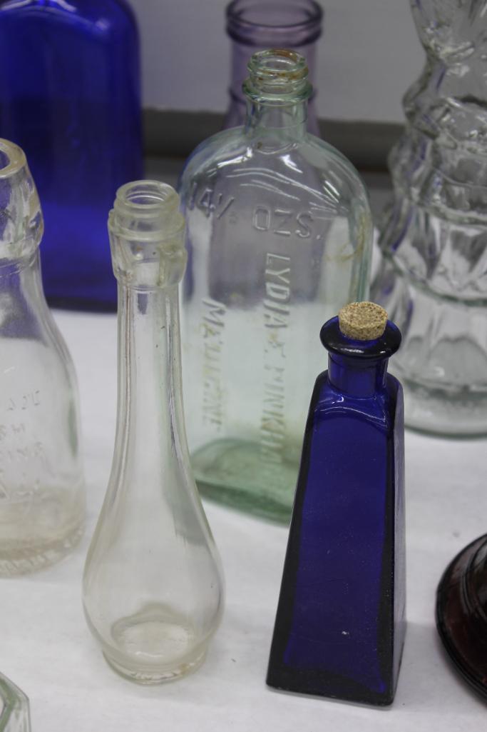Mixed Clear and Colorful Glass Bottles, Insulators, and More