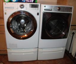 Front-Opening LG Washer and Kenmore Dryer on Stand Bases