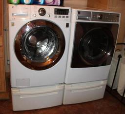 Front-Opening LG Washer and Kenmore Dryer on Stand Bases