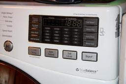 Front-Opening LG Washer and Kenmore Dryer on Stand Bases