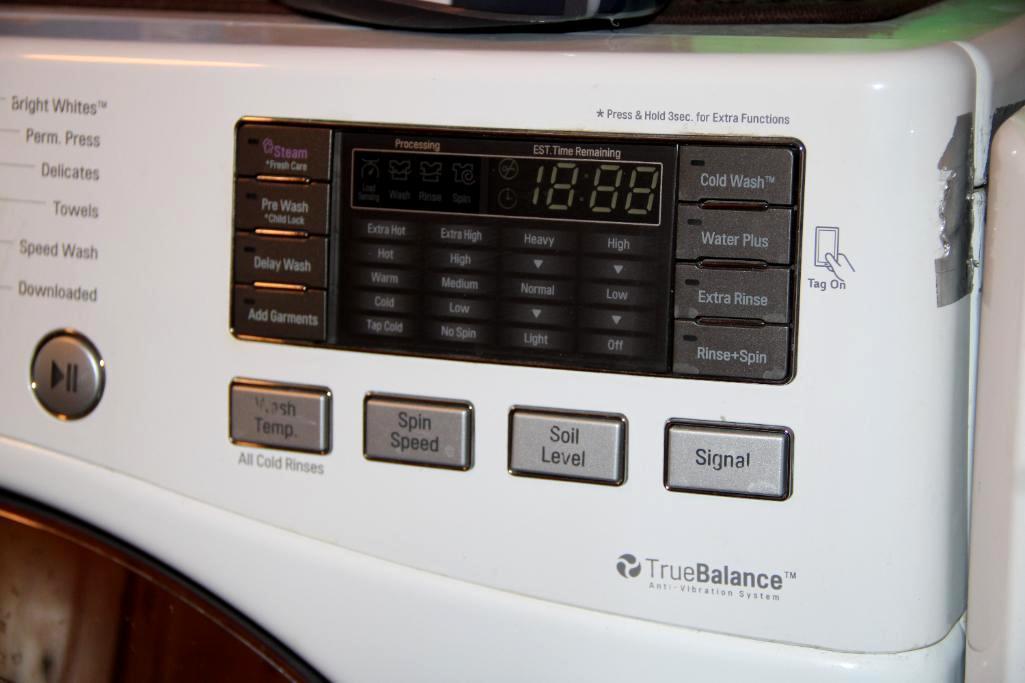 Front-Opening LG Washer and Kenmore Dryer on Stand Bases