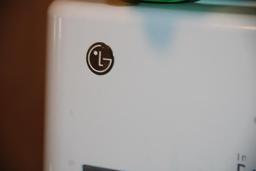 Front-Opening LG Washer and Kenmore Dryer on Stand Bases