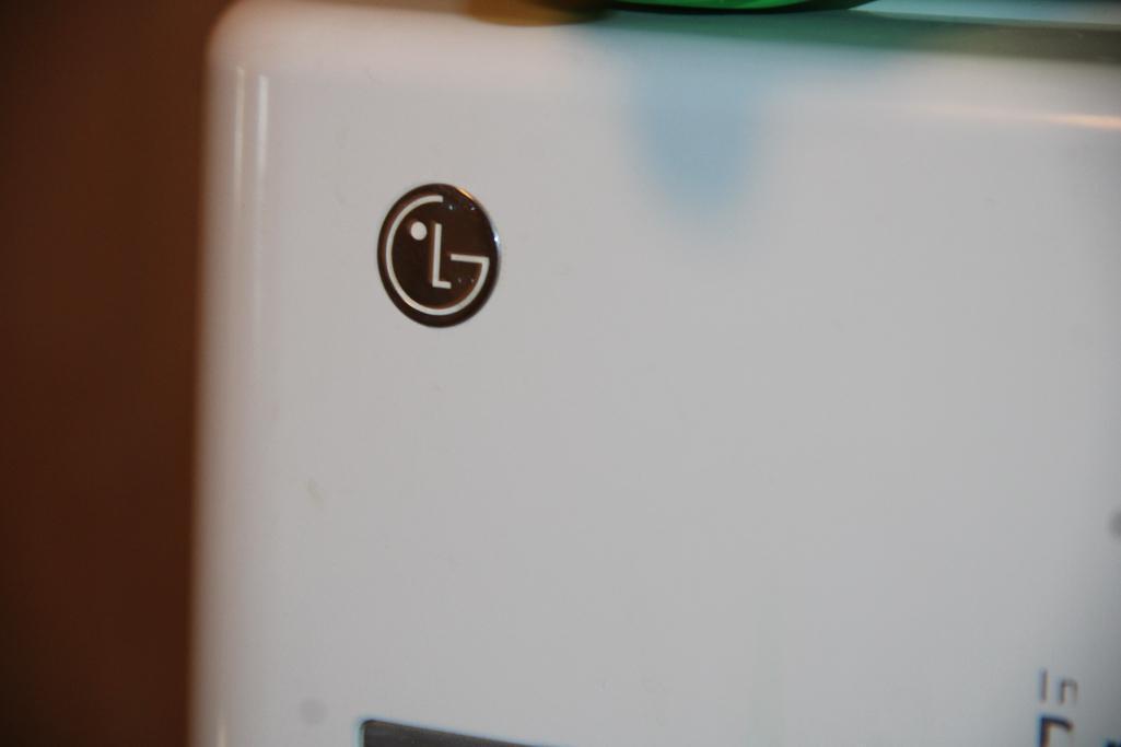 Front-Opening LG Washer and Kenmore Dryer on Stand Bases