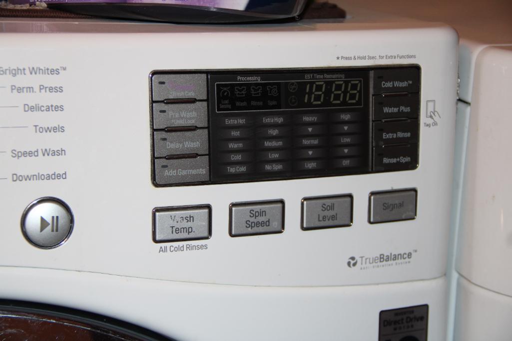 Front-Opening LG Washer and Kenmore Dryer on Stand Bases