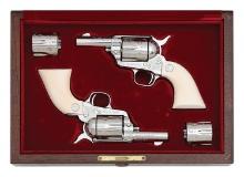 Exquisite Cased Pair of Engraved Colt Third Generation Sheriff's Model Single Action Army Revolvers