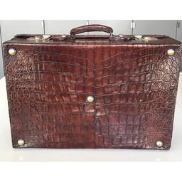 **Regretfully Withdrawn**Brown crocodile skin suitcase