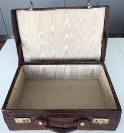 **Regretfully Withdrawn**Brown crocodile skin suitcase