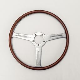 A  race used period steering wheel hand signed by Stirling Moss