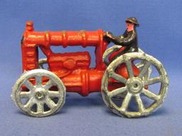 Painted Cast Iron Model of Farmer Driving Tractor – 5 1/4” long – Newer – Good condition, as shown