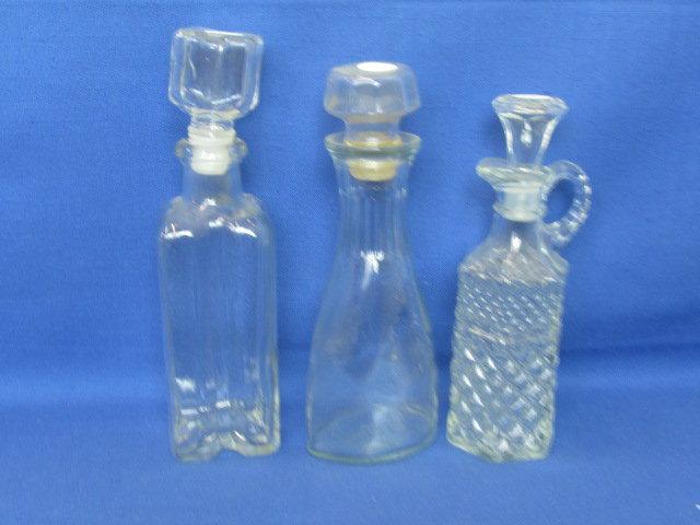 3 Clear Glass Bottles w/ Stoppers 9”, 8” & 7” Tall