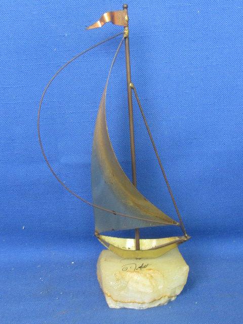 Mid Century Brutalist Brass Sailboat Sculpture on raw edge onyx base. By DeMott Signed, DeMott.