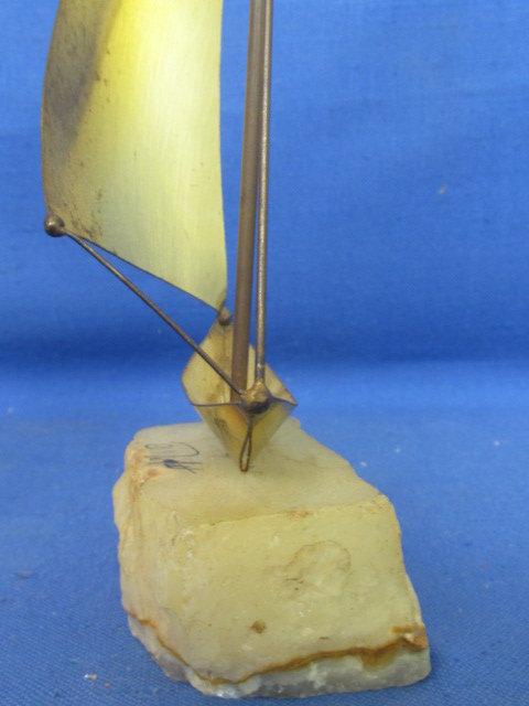 Mid Century Brutalist Brass Sailboat Sculpture on raw edge onyx base. By DeMott Signed, DeMott.