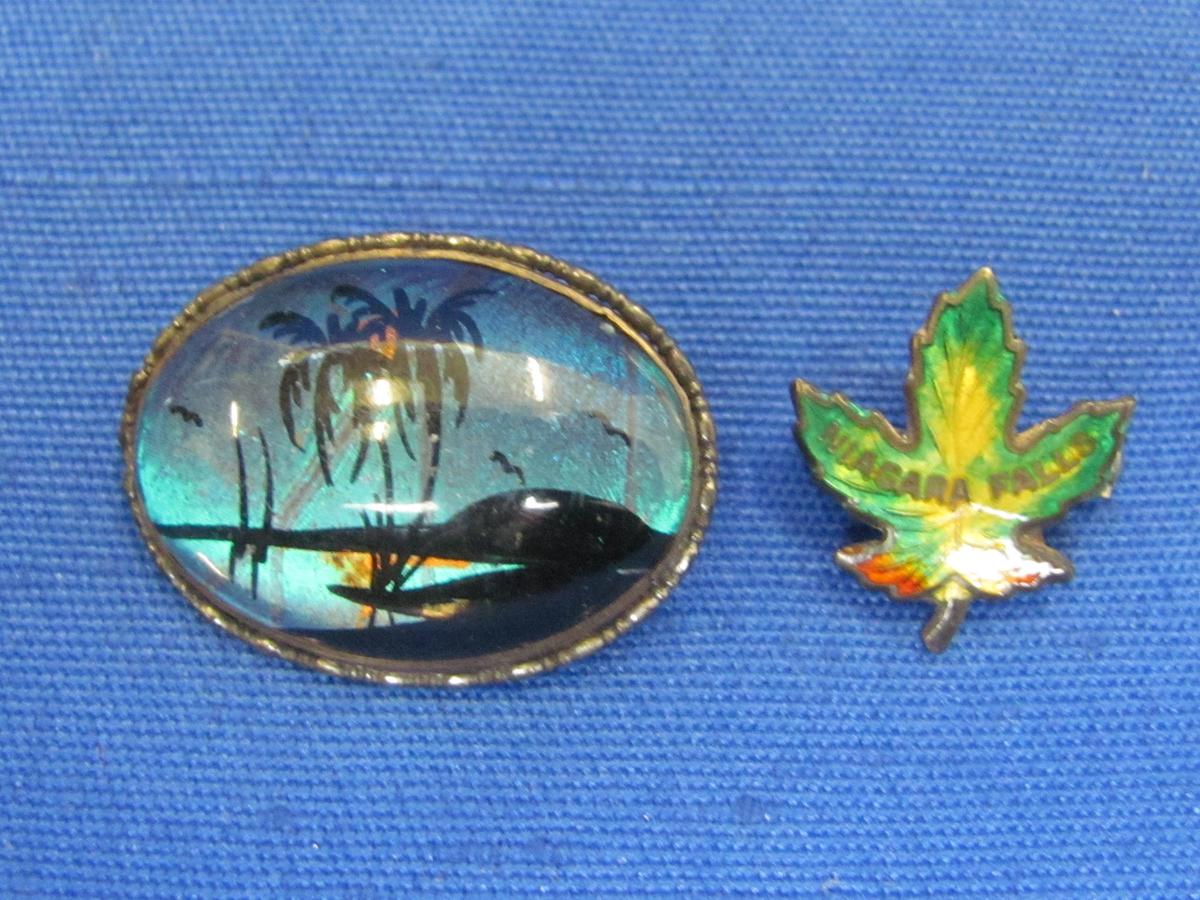 2 Sterling Silver Souvenir Pins – 1 Enamel from Niagara Falls – 1 Tropical Beach Scene