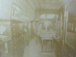 Matted Sepia Photographs – Interior of a Bank with Tellers in Cages – Mat is 22 3/4” long