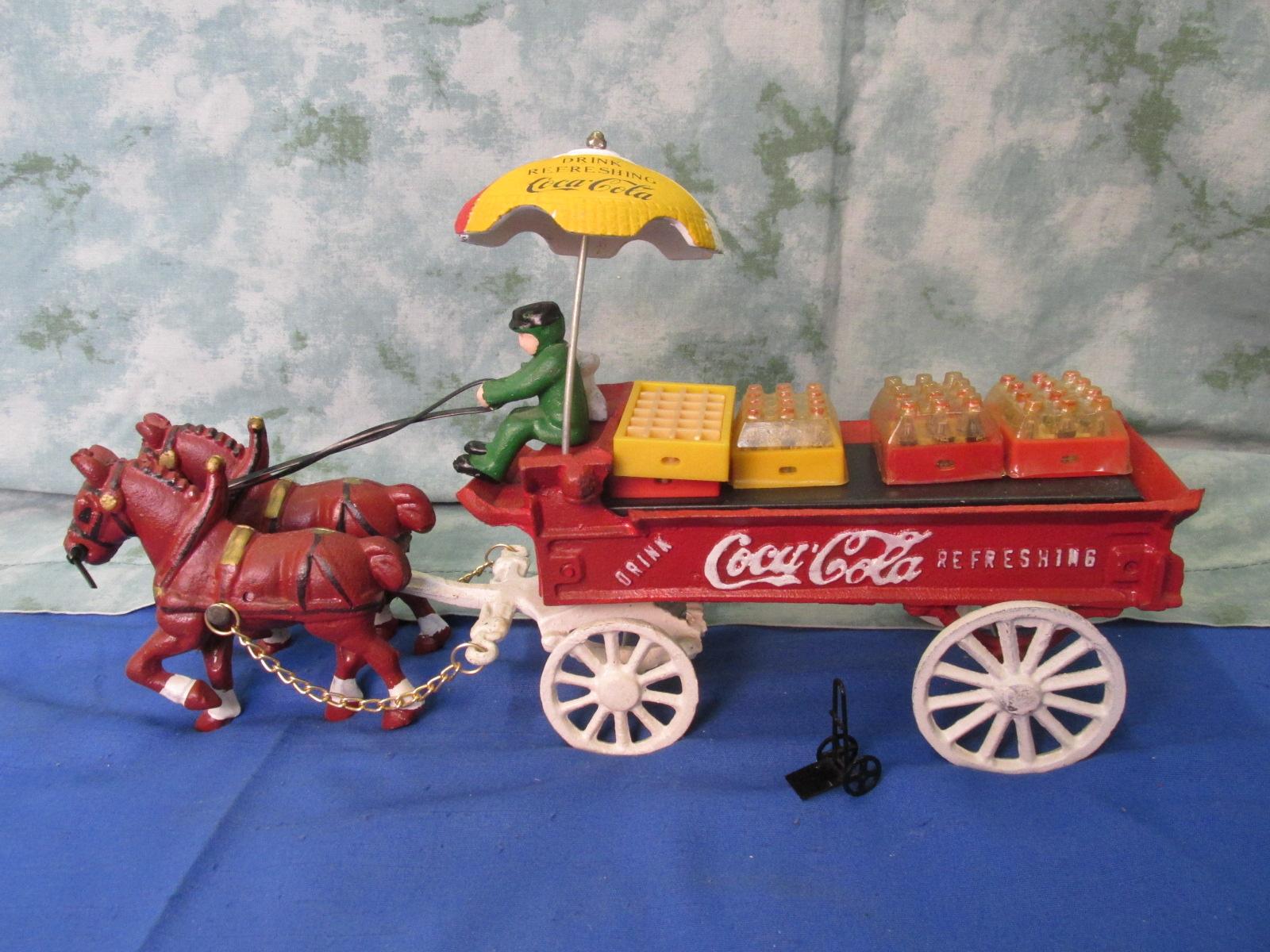 Cast Iron Coca Cola Wagon – 2 Horse team, 1 Driver, 1 Dog, 5 cases, 1 dolly, 1 Umbrella