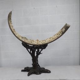 A full length male Woolly Mammoth incisor profusely carved