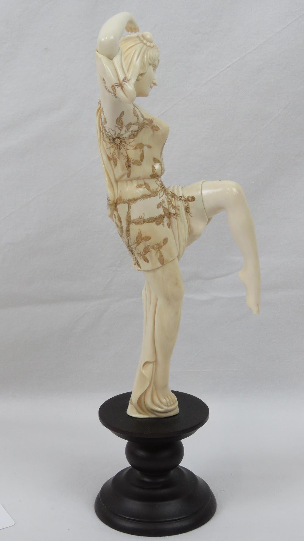 A delightful carved and polished Woolly Mammoth tusk segment in the form of a European dancing lady