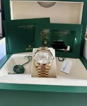 New 18kt Yellow Gold 40mm DayDate Rolex comes with Box & Papers