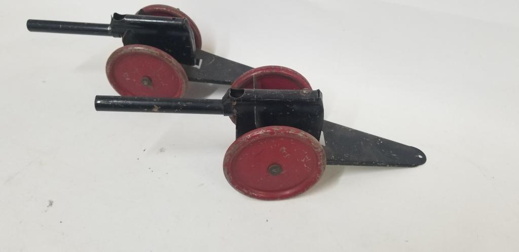 2 tin toy cannons