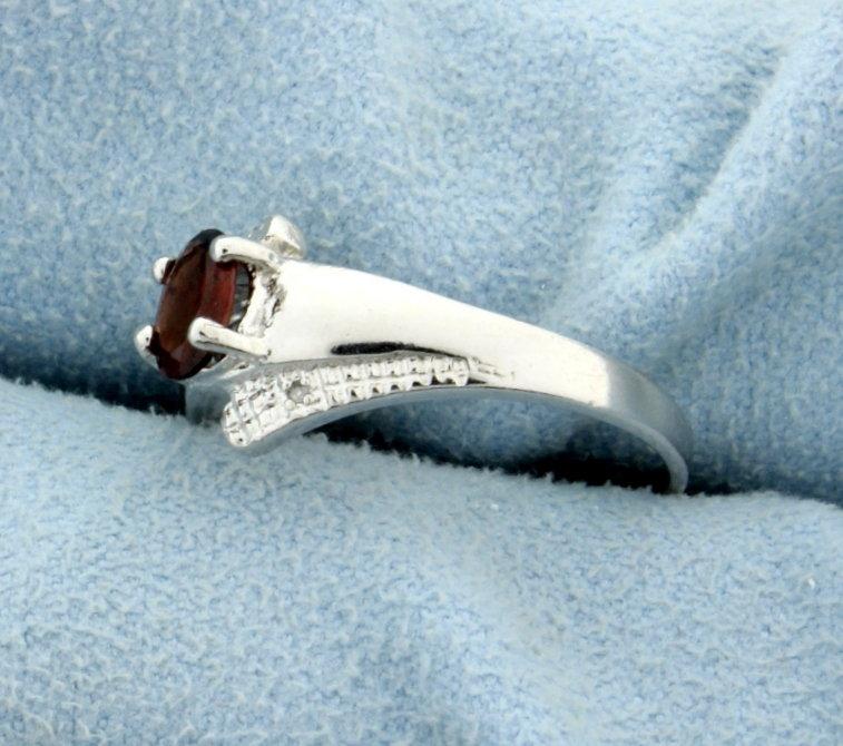 Garnet And Diamond Ring In Platinum Over Sterling Silver