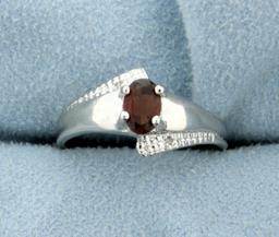 Garnet And Diamond Ring In Platinum Over Sterling Silver