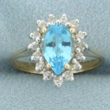 Blue Topaz And Diamond Halo Ring In 14k Yellow Gold