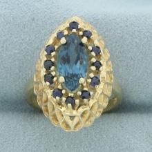 Marquise Sapphire Halo Ring In 14k Yellow Gold