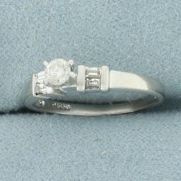 Round And Baguette Diamond Engagement Ring In Platinum
