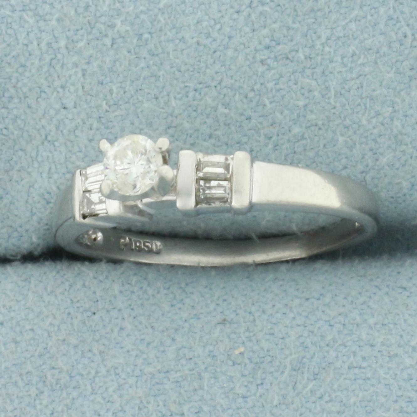 Round And Baguette Diamond Engagement Ring In Platinum