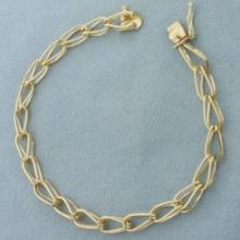 Double Tapered Loop Link Charm Bracelet In 14k Yellow Gold