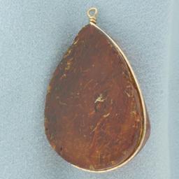 Teardrop Shape Amber Pendant In 14k Yellow Gold