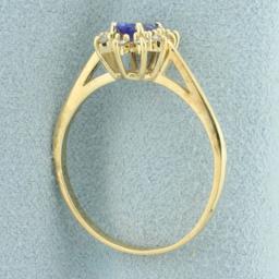 Tanzanite And Diamond Halo Ring In 14k Yellow Gold