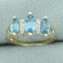 Marquise Blue Topaz And Diamond Ring In 14k Yellow Gold