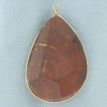 Teardrop Shape Amber Pendant In 14k Yellow Gold