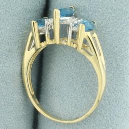 Marquise Blue Topaz And Diamond Ring In 14k Yellow Gold