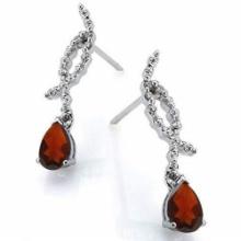 1.5ctw Pear Cut Garnet And Diamond Dangle Twist Earrings In Platinum Over Sterling Silver