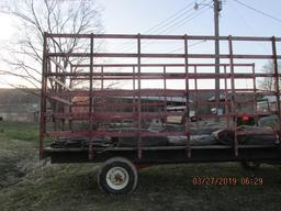 Flat bed hay wagon with metal racks