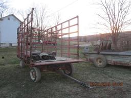 Flat bed hay wagon with metal racks