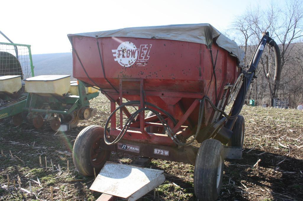 EZ Flow gravity bin w/ new Unverferth side auger on EZ Trailer 872-W runnng gear