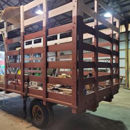 Hoover built wooden hay rack on good running gears