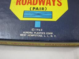 Aurora HO Scale Slot Track No. 1524 9 inch 2 lane "Crisscross Roadways" (Pair), in original box,