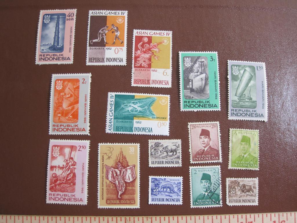 Lot of colorful Indonesia postage stamps, many of them unused