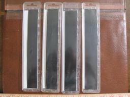 Four packs of Scott brand black stamp mount strips for stamps 22, 24, 25 and 27 mm high. 22 mm