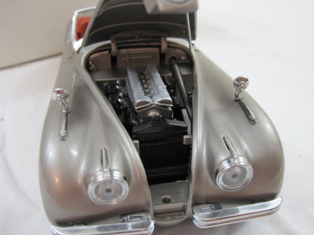 The 1949 Jaguar XK120 Diecast Model Car, The Danbury Mint, in original box, damage to windshield, AS