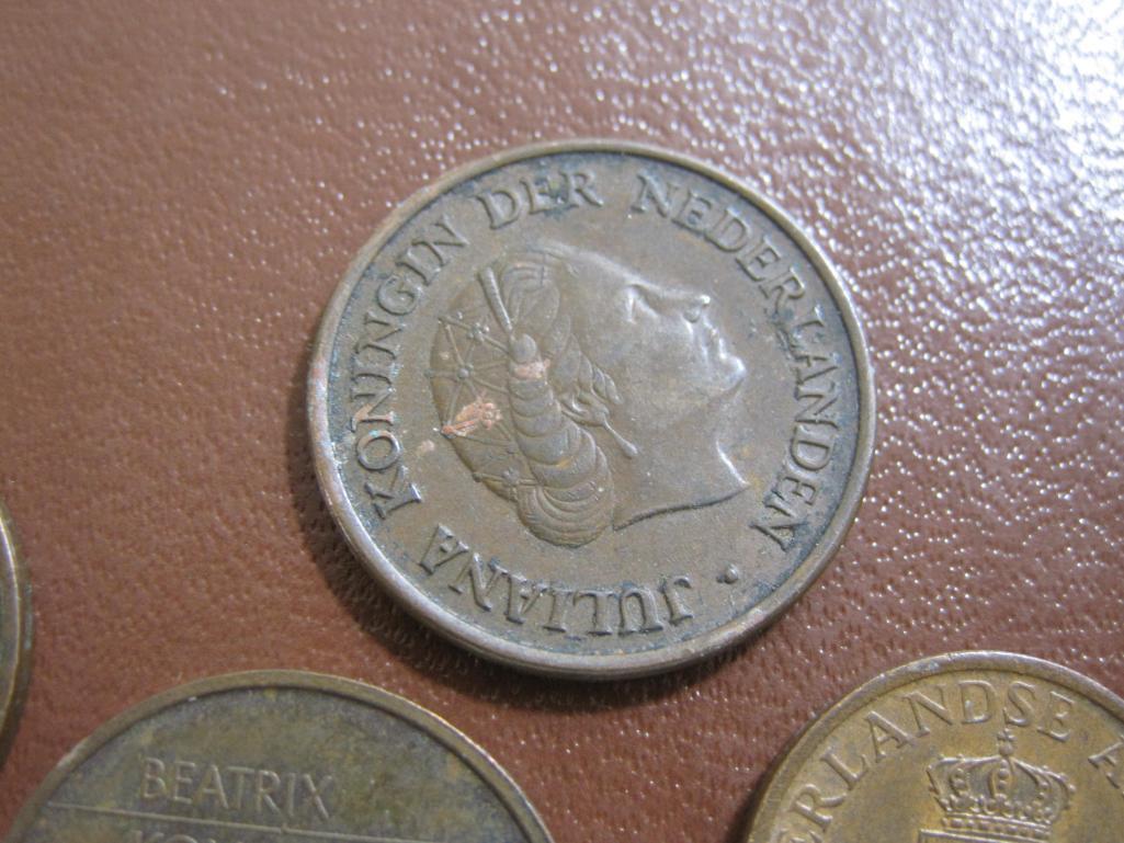 One Finnish 10 pennia coin plus 8 Netherlands coins