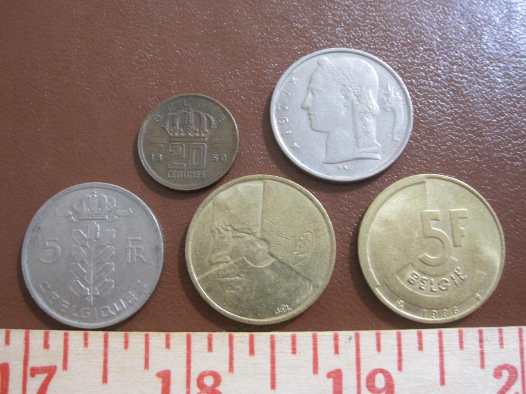 Lot of five Belgian coins: one 1960 20 centimes, two 5 francs (1974 & 77) and two 1986